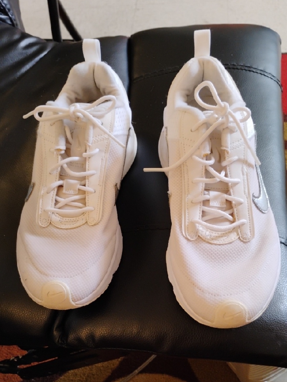 Nike White Sneakers with Silver Swoosh Accent